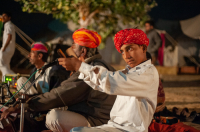  Musicians performing traditional Rajasthani music for tourists who camp in the desert.