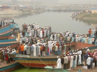 Pilgrims flow into the bank of Turag