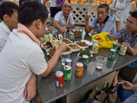 Colleagues from office having lunch in Chinatown on the eve of Chinese New Year in Singapore