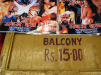 INDIA.Film posters outside an old picture house in Mumbai.
