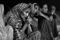 Women praying on the Ganga River..