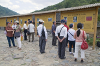 CHINA Chinese tourists visiting the ancestors temple and memorial wall in a traditional Hakka village in Fujian province.