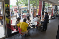 CHINA Local people eating inside a KFC fast food restaurant in Guangzhou, Guangdong province.