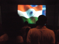 INDIA.Singing the Indian national anthem before the projection of a film at the Regal Cinema in Mumbai.