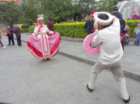 CHINA Chinese tourists photographing Ethnic Bei women dressed in traditional costume in Dali, Yunnan province.