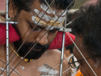 Thaipusam Hindu Tamil festival in Singapore. Devotees have their bodies pierced with skewers