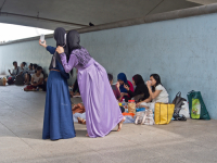 Migrant domestic workers enjoy a day off by the Bay side in Singapore