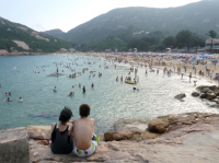 CHINA Couple during weekend at Shek o beach in Hong Kong.