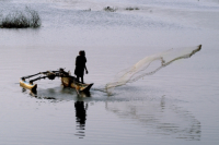 Fisherman with net cast